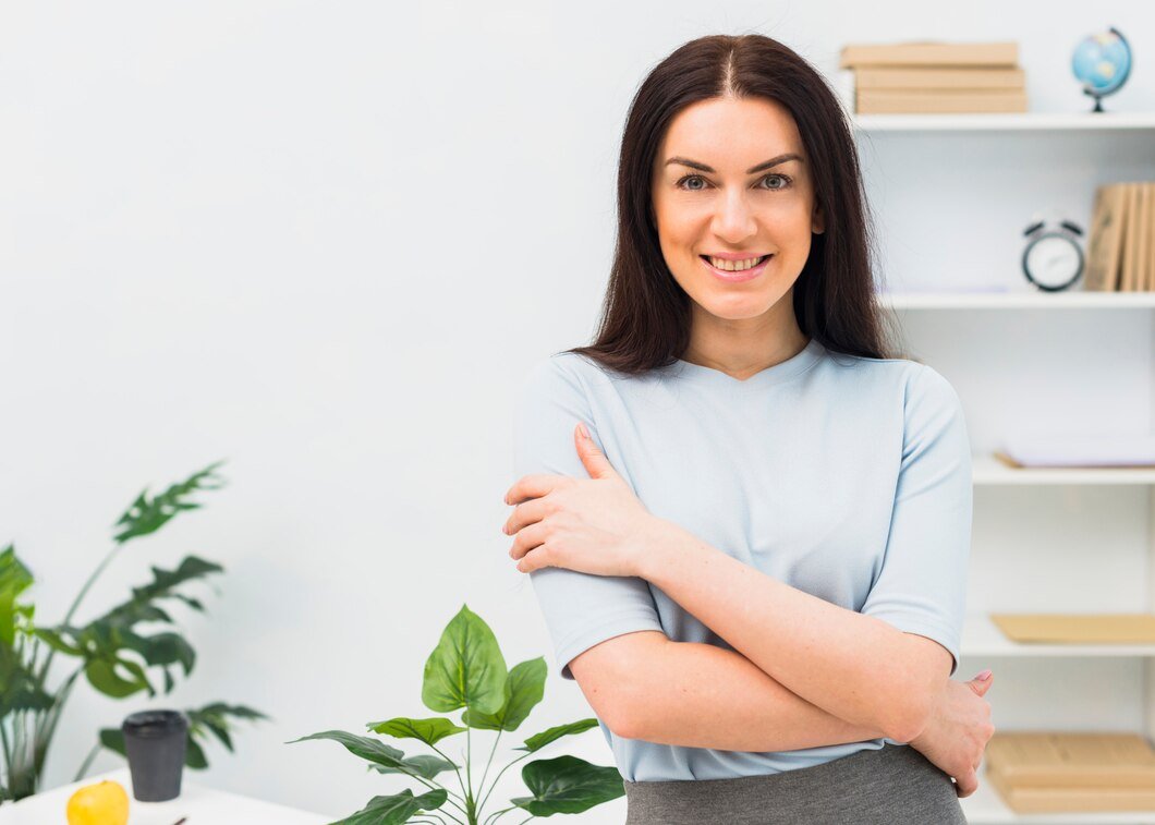 A woman standing in a bright room